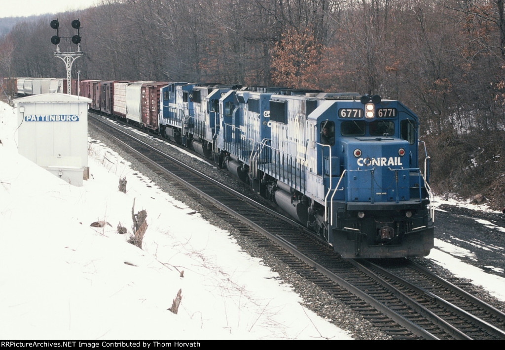 CR 6771 leads CR's PIOI east out of the passing siding on a snowy day